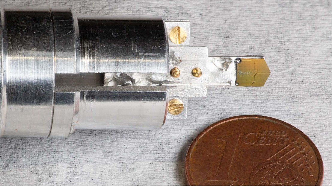 Photograph of the photonic chip mounted on a custom holder. Credit: Yang et al 2025. Photograph of the photonic chip mounted on a custom holder. Credit: Yang et al 2025.