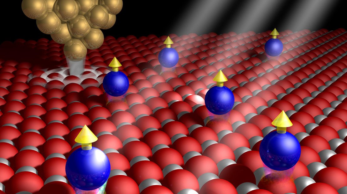 Cobalt atoms (blue) interacting with the MgO surface, microscope tip (gold) and X-rays © 2014 EPFL Cobalt atoms (blue) interacting with the MgO surface, microscope tip (gold) and X-rays © 2014 EPFL