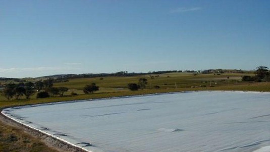 Or by a tarp. But these solutions don't adapt to the changing size and shape of the ponds.